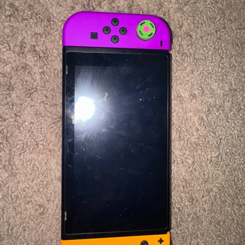 Purple and Orange Gaming Console